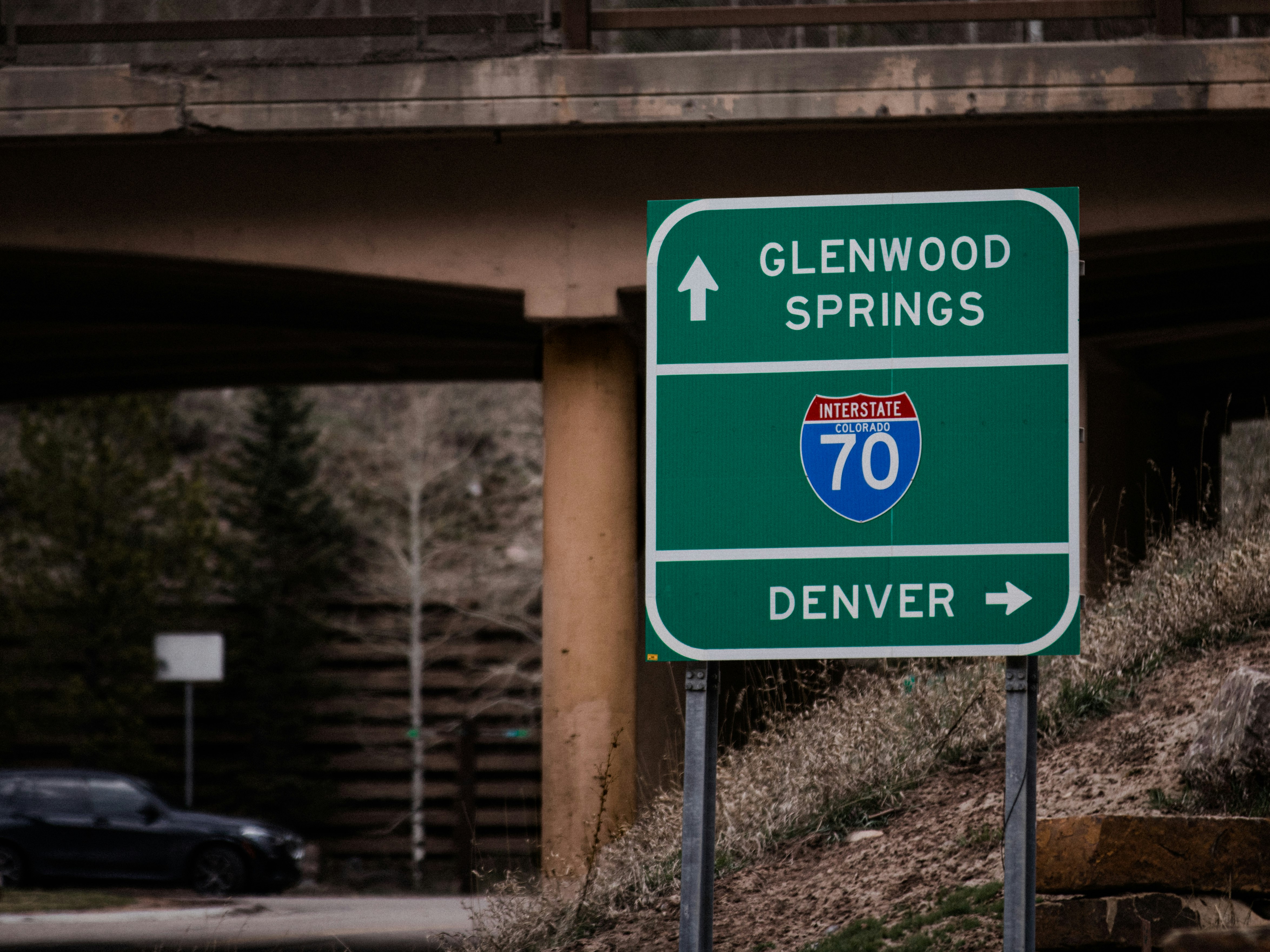 green and white road sign